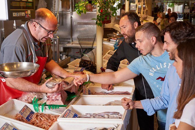 Feed the Fire Private Cooking Class & Market Tour - Walking to the natural wine shop where the cooking happens